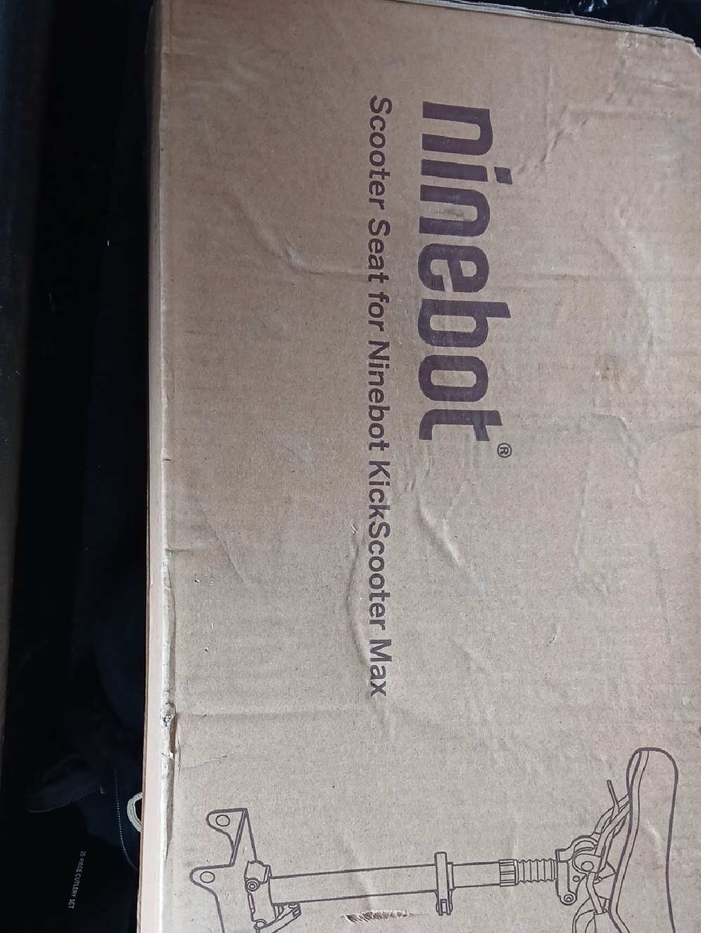 Scooter Seat in Brown Cardboard Packaging